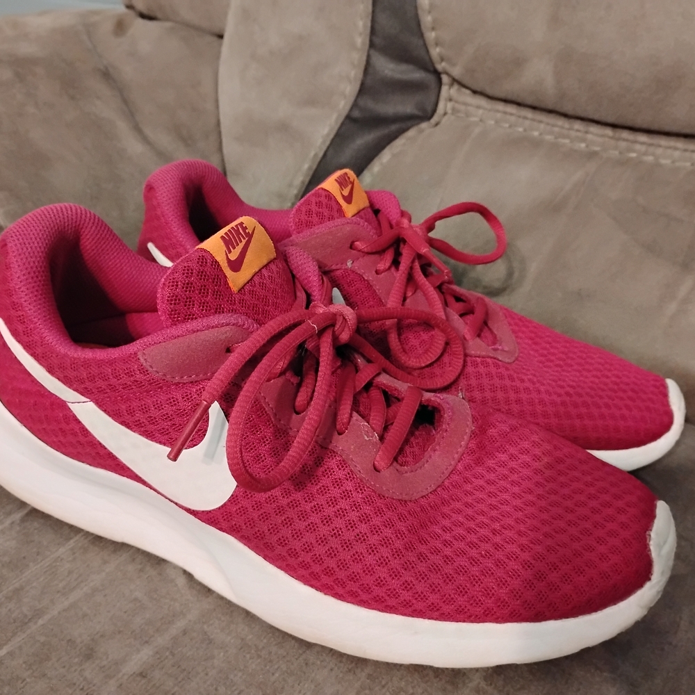 Nike Pink and Orange Sneakers with Sleek Design